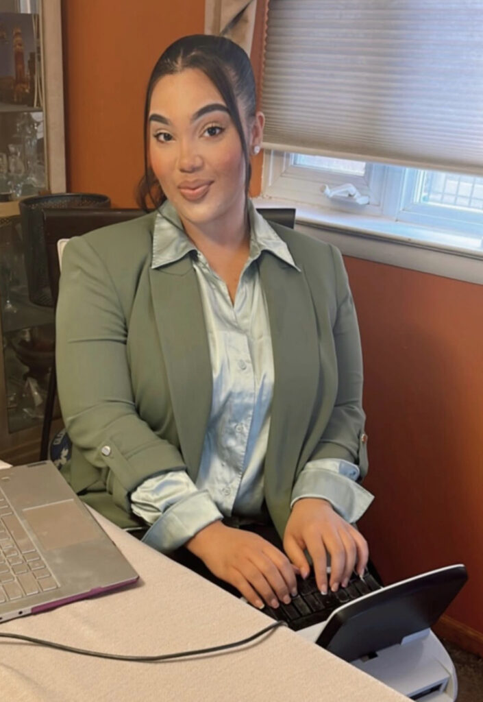 CASE winner Bianca Blocker sitting at her steno machine