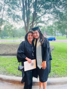 Baylee Richards in cap and gown with colleague