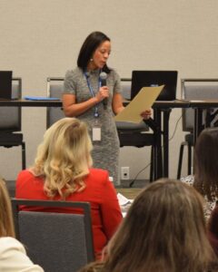 A woman reading a proclamation