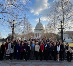 2025 Leadership and Legislative Boot Camp attendees in group photo in front of the West lawn of the U.S. Capitol.