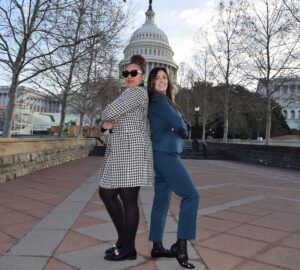 Two NCRA members in front of the West side of the Capitol building