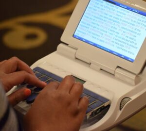 Hands typing on a steno machine